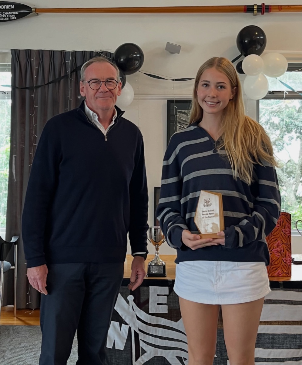 Board Chair Richard Hughes presenting a trophy at prizegiving